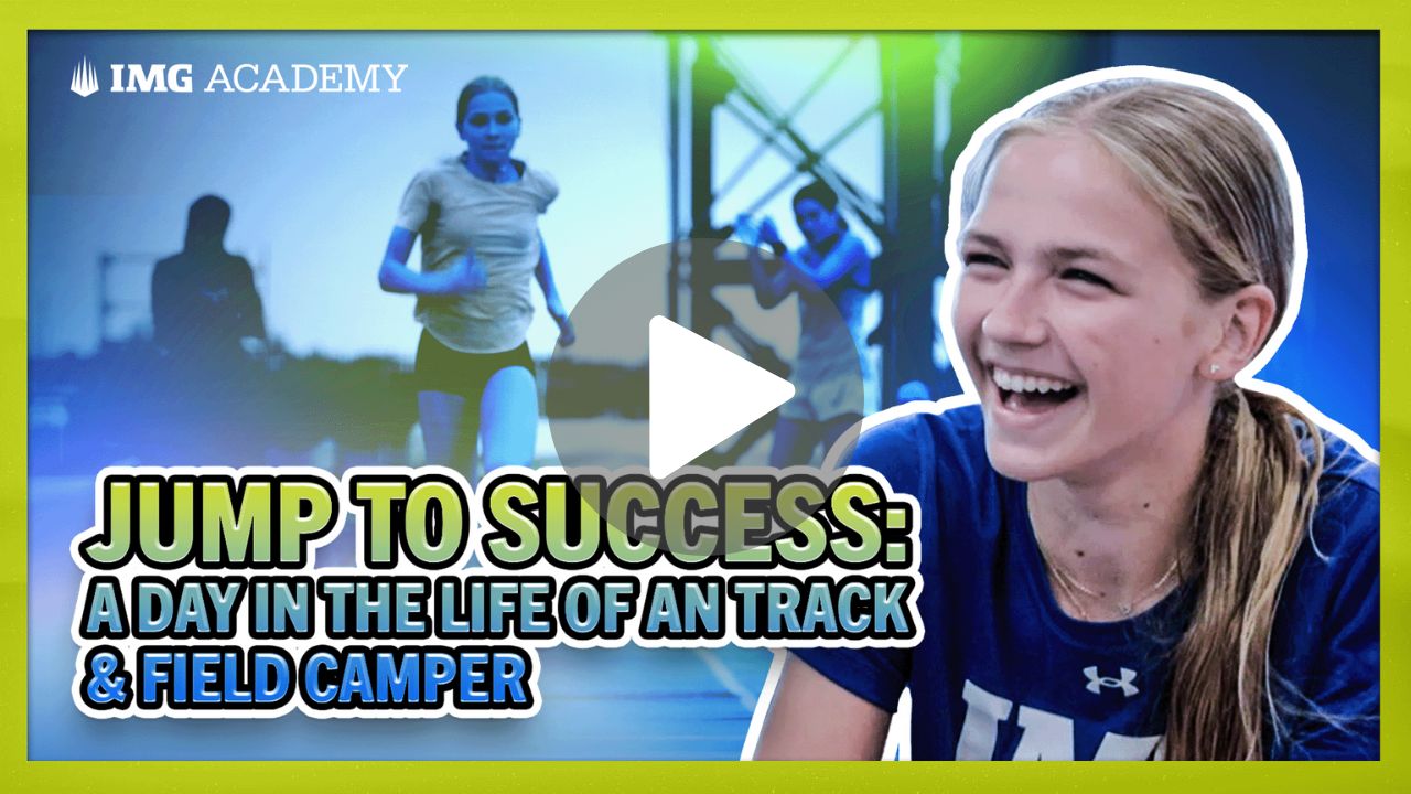 A basketball player from the img academy is holding a wilson basketball